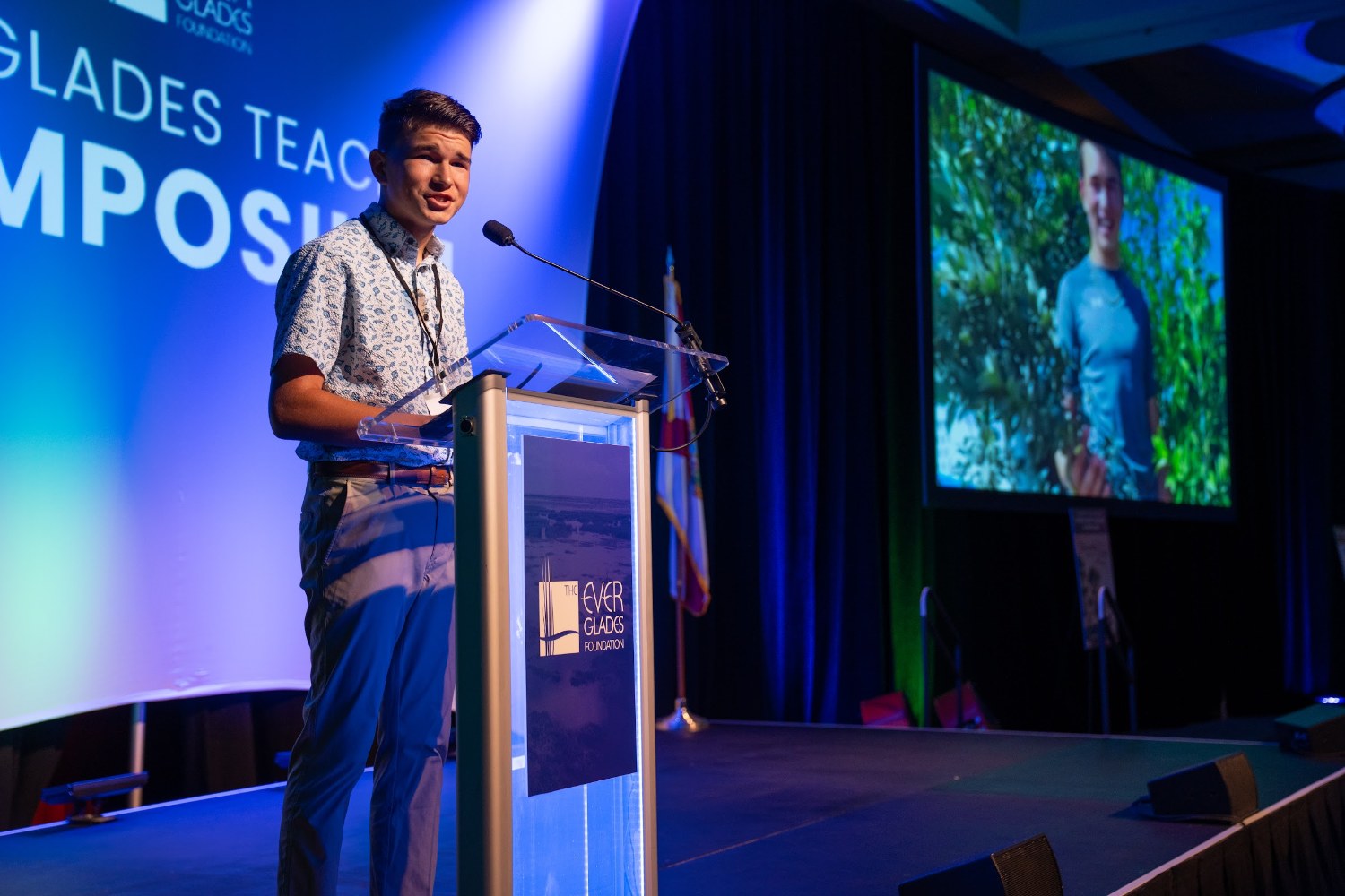Keynote speaker Isaac Nelson at the Everglades Teacher Symposium podium