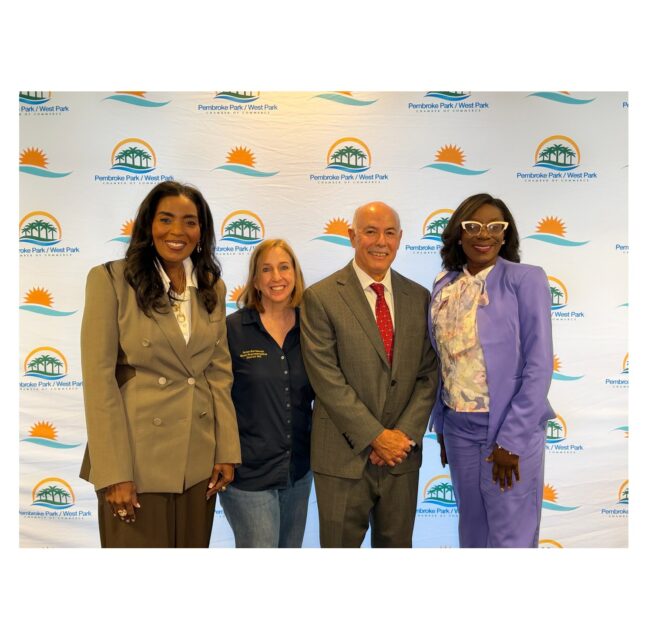 Four elected officials posing together at the Eggs & Issues Legislative Breakfast