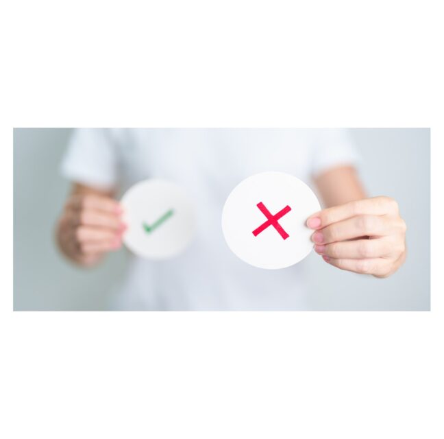 Hands holding a green check mark and a red X on paper circles