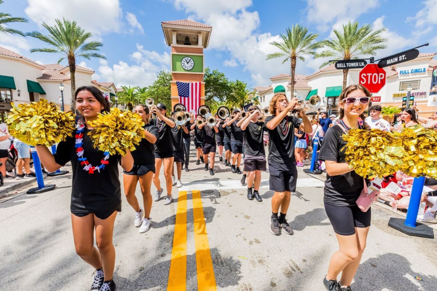 Cheerleaders and a marching band in a Weston parade